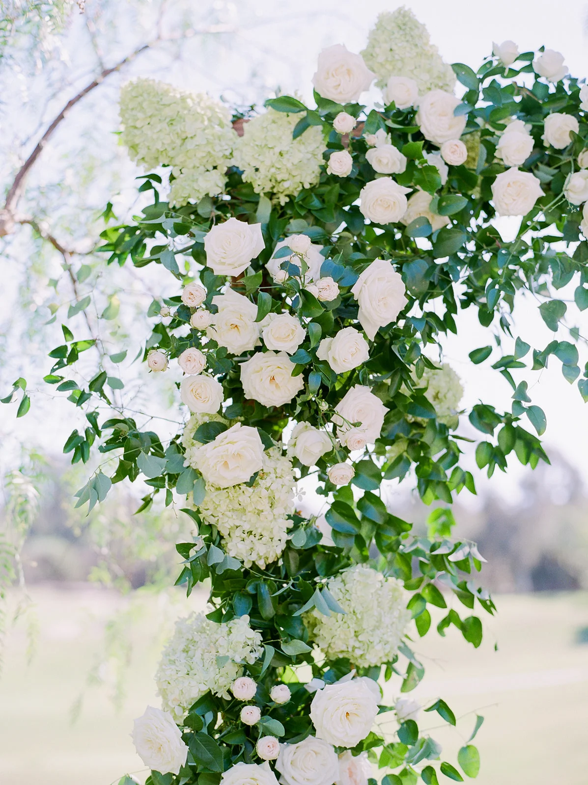 Romantic wood arch covered in greenery and flowers, outdoor ceremony | Rancho Santa Fe Golf Club | Compass Floral | Wedding Florist in San Diego and Southern California | Rachael McCall Photography