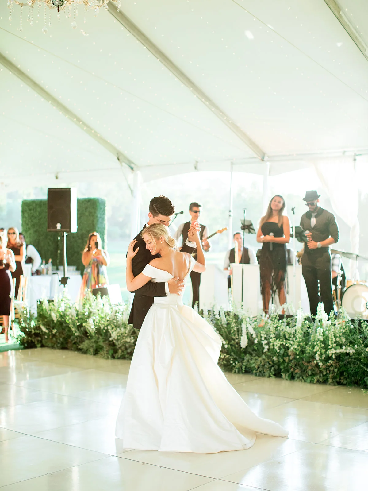 Bride and groom first dance, stage flowers | Rancho Santa Fe Golf Club | Compass Floral | Wedding Florist in San Diego and Southern California | Rachael McCall Photography