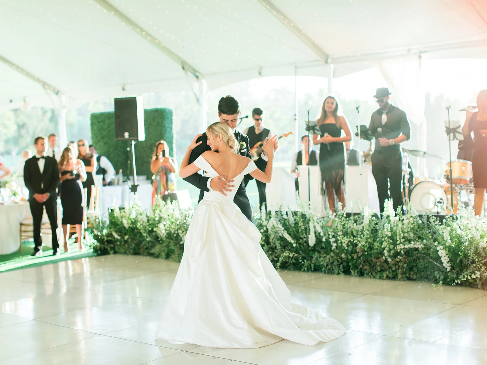 Bride and groom first dance, stage flowers | Rancho Santa Fe Golf Club | Compass Floral | Wedding Florist in San Diego and Southern California | Rachael McCall Photography