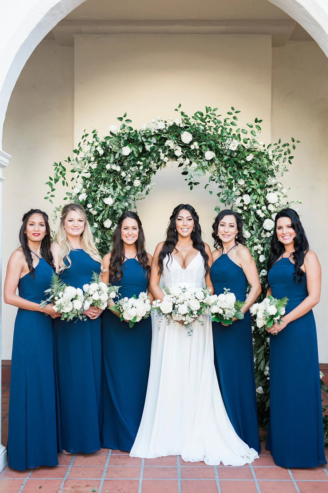 Bridesmaids in blue, white bouquets, elegant greenery arch | Darlington House, La Jolla | Compass Floral | Wedding Florist in San Diego and Southern California | My Sun and Stars Co. Photography