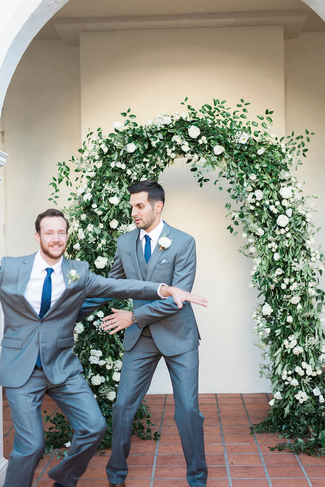 Fun groomsmen poses, elegant greenery arch | Darlington House, La Jolla | Compass Floral | Wedding Florist in San Diego and Southern California | My Sun and Stars Co. Photography