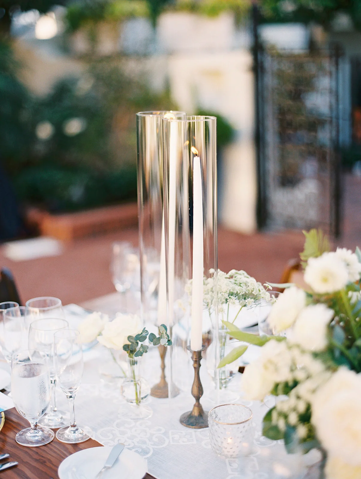 Taper candle in brass candlestick | Darlington House, La Jolla | Compass Floral | Wedding Florist in San Diego and Southern California | My Sun and Stars Co. Photography