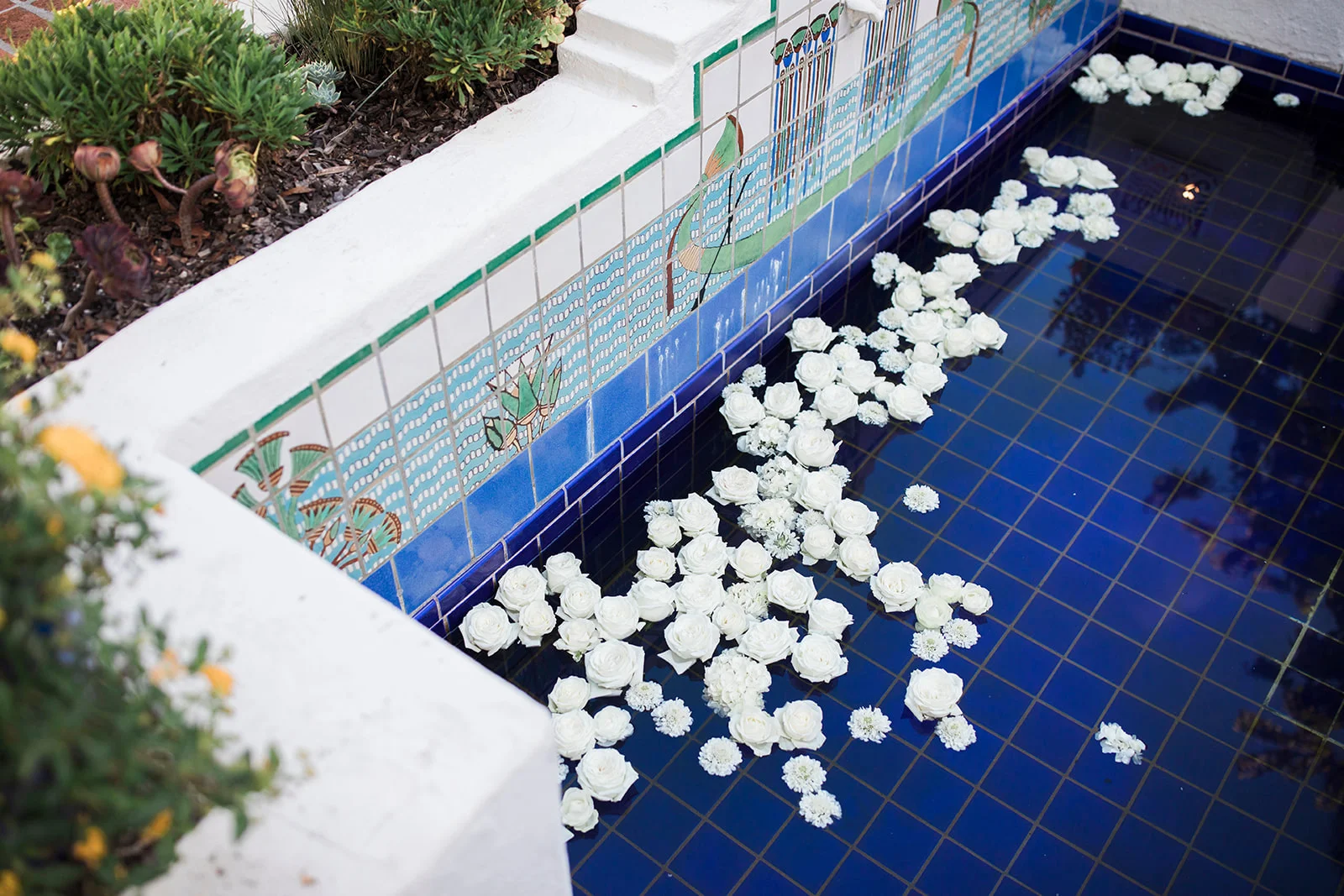 White floating flowers in blue tiled pool | Darlington House, La Jolla | Compass Floral | Wedding Florist in San Diego and Southern California | My Sun and Stars Co. Photography