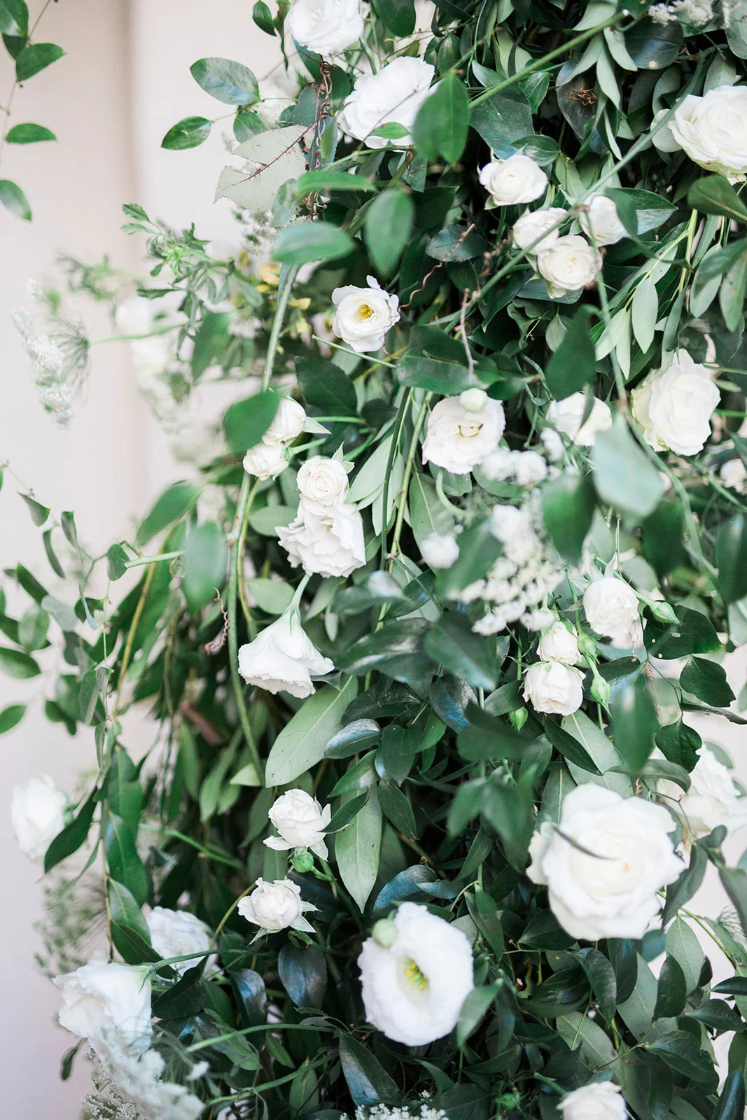 White flowers and smilax covered rounded wedding ceremony arch | Darlington House, La Jolla | Compass Floral | Wedding Florist in San Diego and Southern California | My Sun and Stars Co. Photography