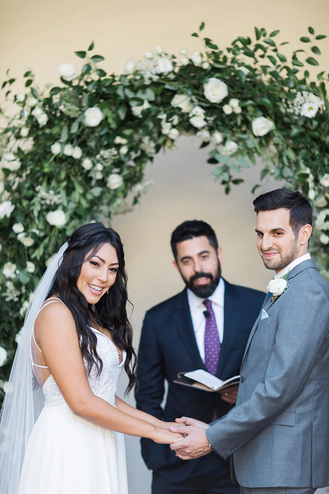 White flowers and smilax covered rounded wedding ceremony arch | Darlington House, La Jolla | Compass Floral | Wedding Florist in San Diego and Southern California | My Sun and Stars Co. Photography