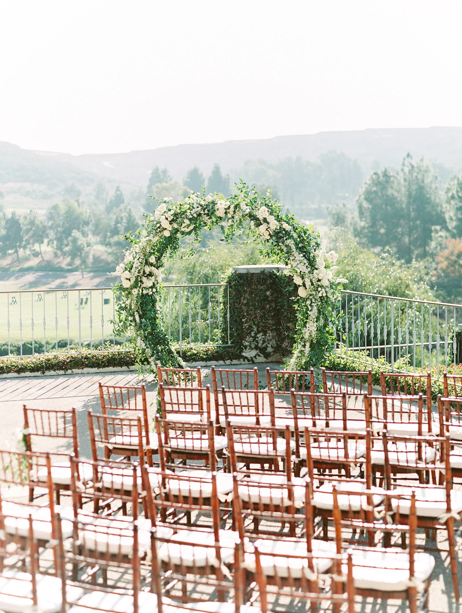 Romantic circle arch covered in white flowers and greenery | Del Mar Country Club | Compass Floral | Wedding Florist in San Diego and Southern California | Cavin Elizabeth Photography