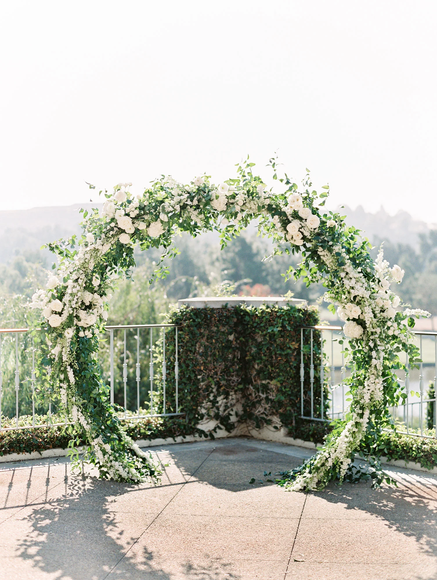 Romantic circle arch covered in white flowers and greenery | Del Mar Country Club | Compass Floral | Wedding Florist in San Diego and Southern California | Cavin Elizabeth Photography