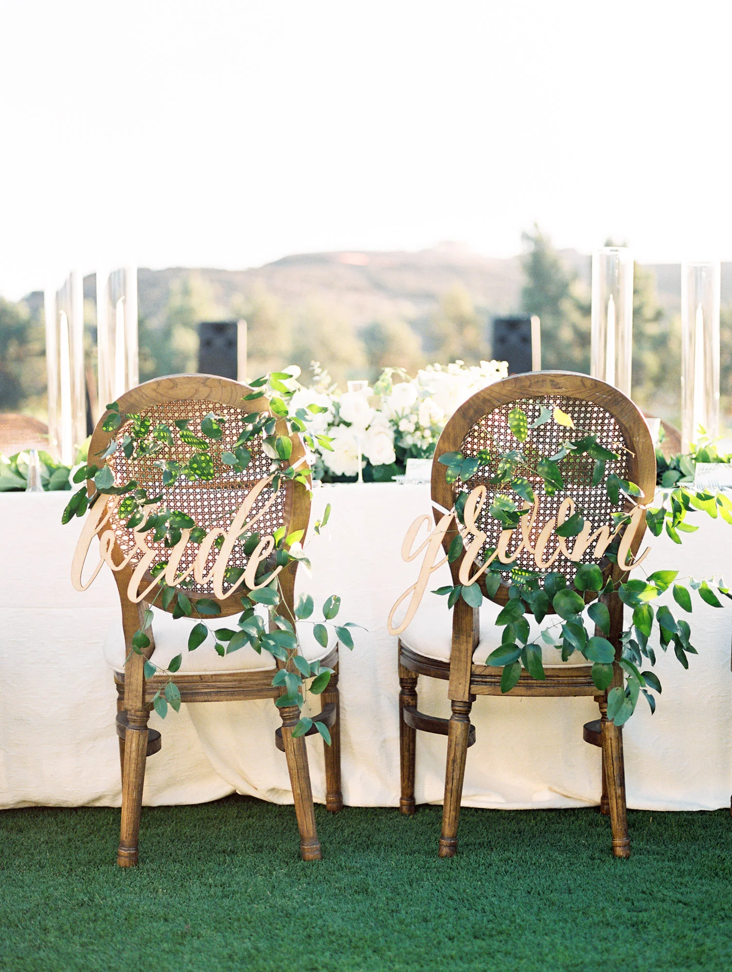 Smilax bride and groom chairs | Del Mar Country Club | Compass Floral | Wedding Florist in San Diego and Southern California | Cavin Elizabeth Photography