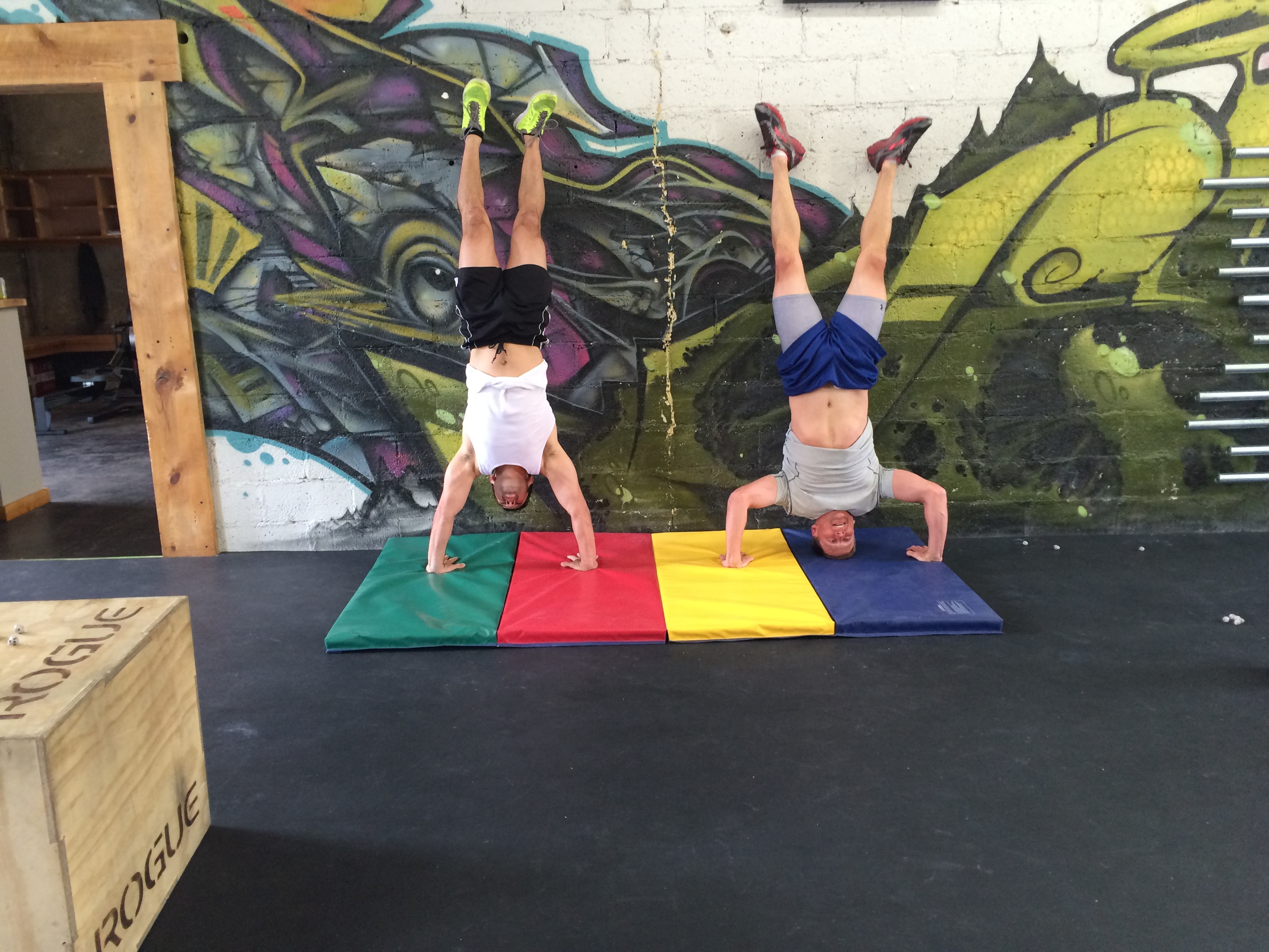 Tom and Beto working the Handstand Push ups last week.