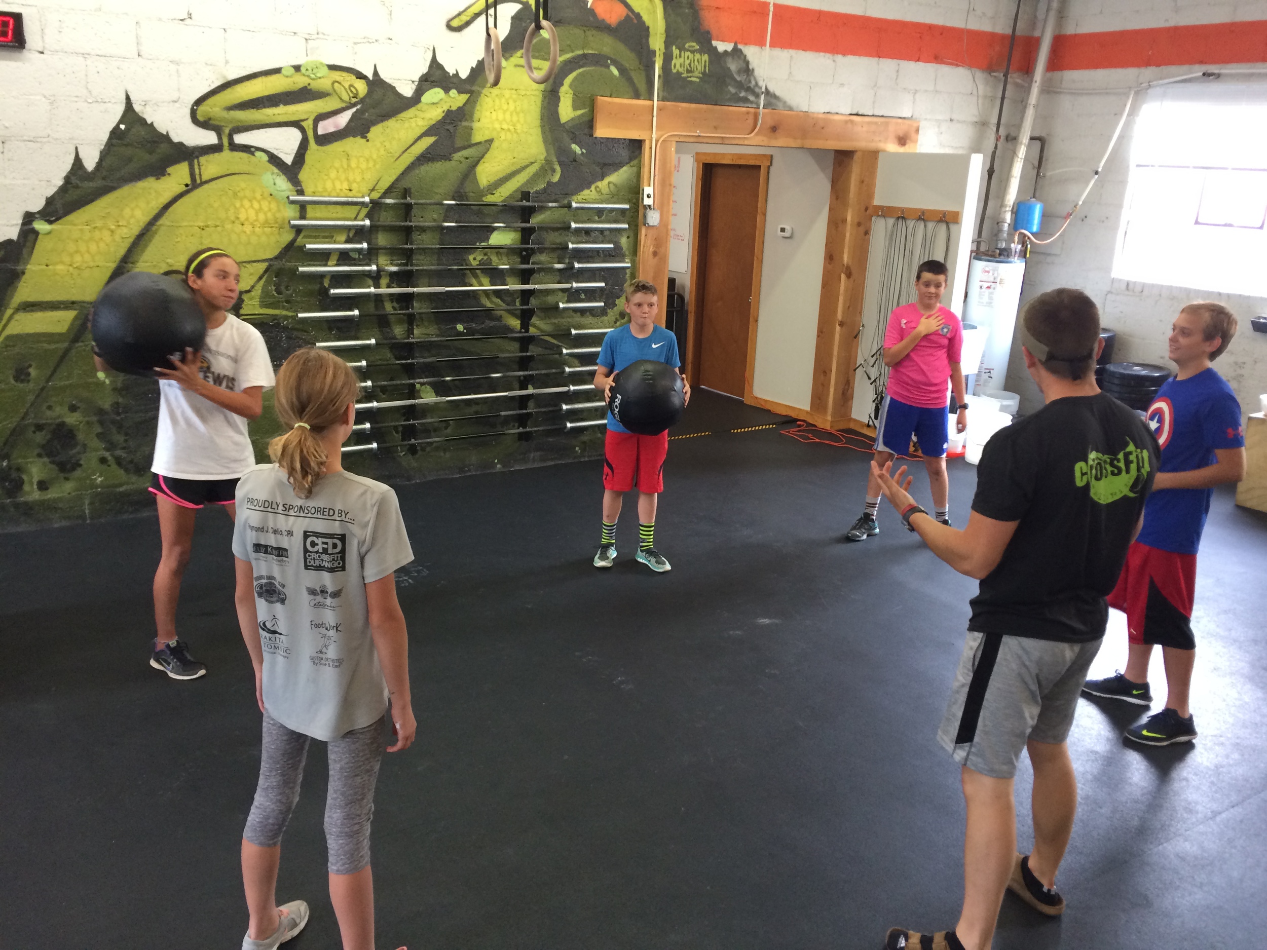 Dustin laying it out for the Middle school t-up! Crew. It's not too late to get a head start on your fall sport. these guys are going to be ready!