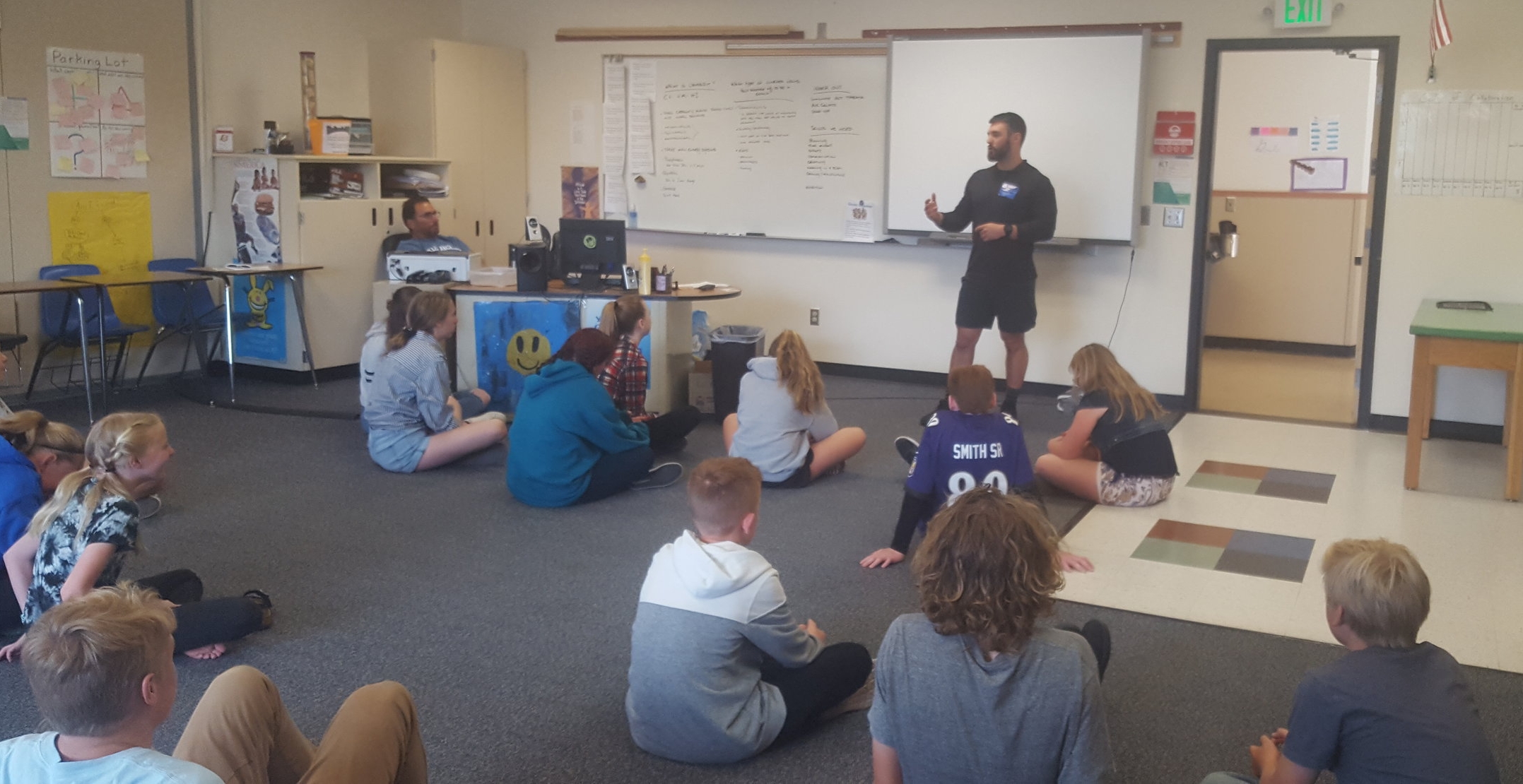 Coach Tony volunteering some time with the kids at Miller Middle School.