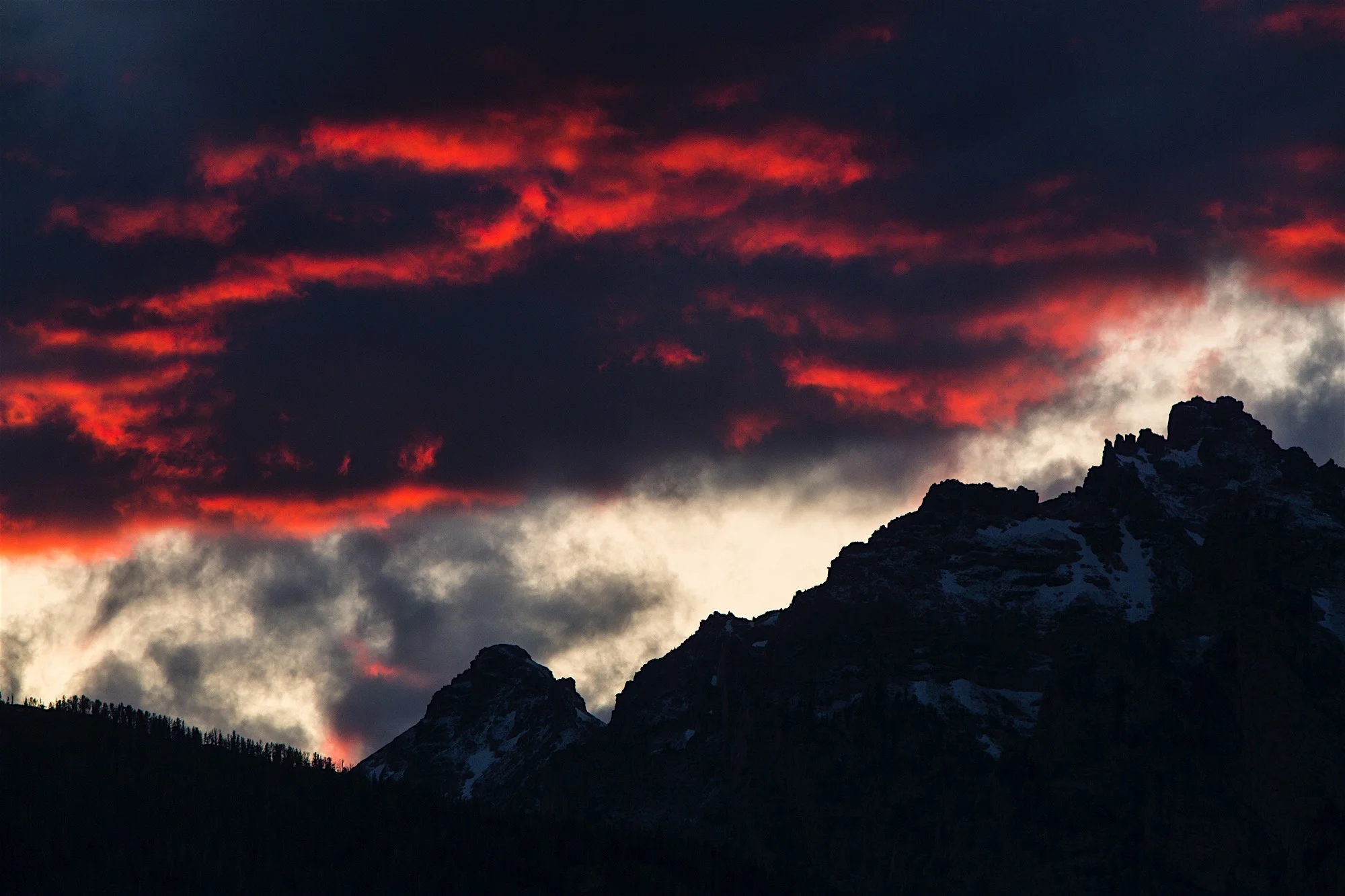 Dramatic clouds loom over Swabachwers Landing in Grand Teton National Park
