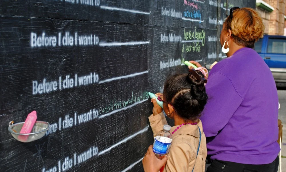 Chalkboard visioning intervention example from artist, Candy Chang .