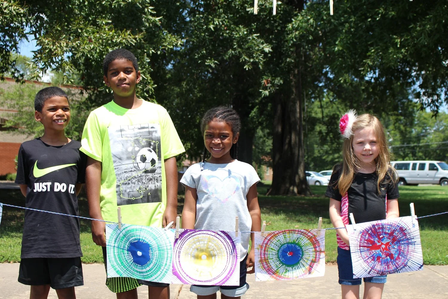 Visitors show off their pedal-art creations they made during Family FunDay on Aug. 11, 2018. Pedal-powered art is just one of the many activities planned during ASC's Tinkerfest 2018, to be held 1-3 p.m. Sept. 8.