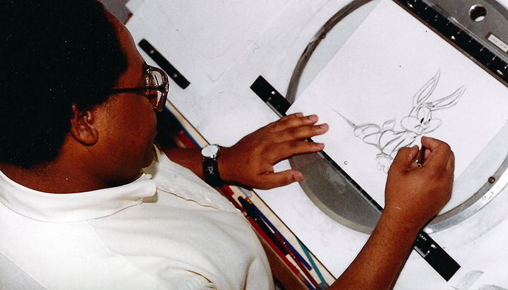 Byron Vaughns draws Tiny Toon Adventures character Buster Bunny at Warner Bros. Studios in the early 1990s. Vaughns, who graduated from UAPB and lives in White Hall, won an Emmy in 1993 when he was director of the cartoon series. PHOTO COURTESY BYRON VAUGHNS, COPYRIGHT WARNER BROS. STUDIOS AND BYRON VAUGHNS