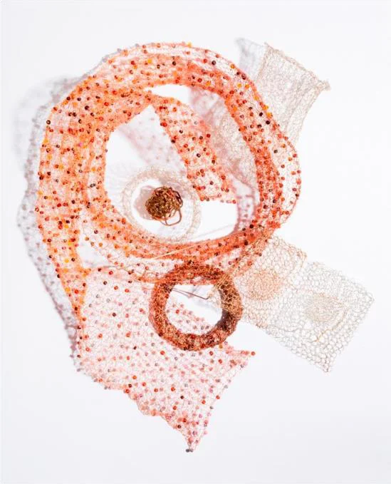 Michele Fox, She wanted to be beautiful, 2017. copper craft wire, assorted hardware, scrap copper, 14k gold filled wire and chain, glass beads, argentium sterling wire, gray tiger eye beads, and suede. IMAGE COURTESY Arkansas Committee of the National Museum of Women in the Arts.