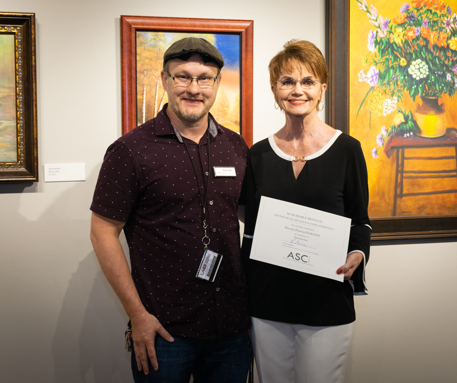 Rhonda Fleming Holderfield (right, with juror Ricky Sikes) was awarded an Honorable Mention for her acrylic painting Summertime. 