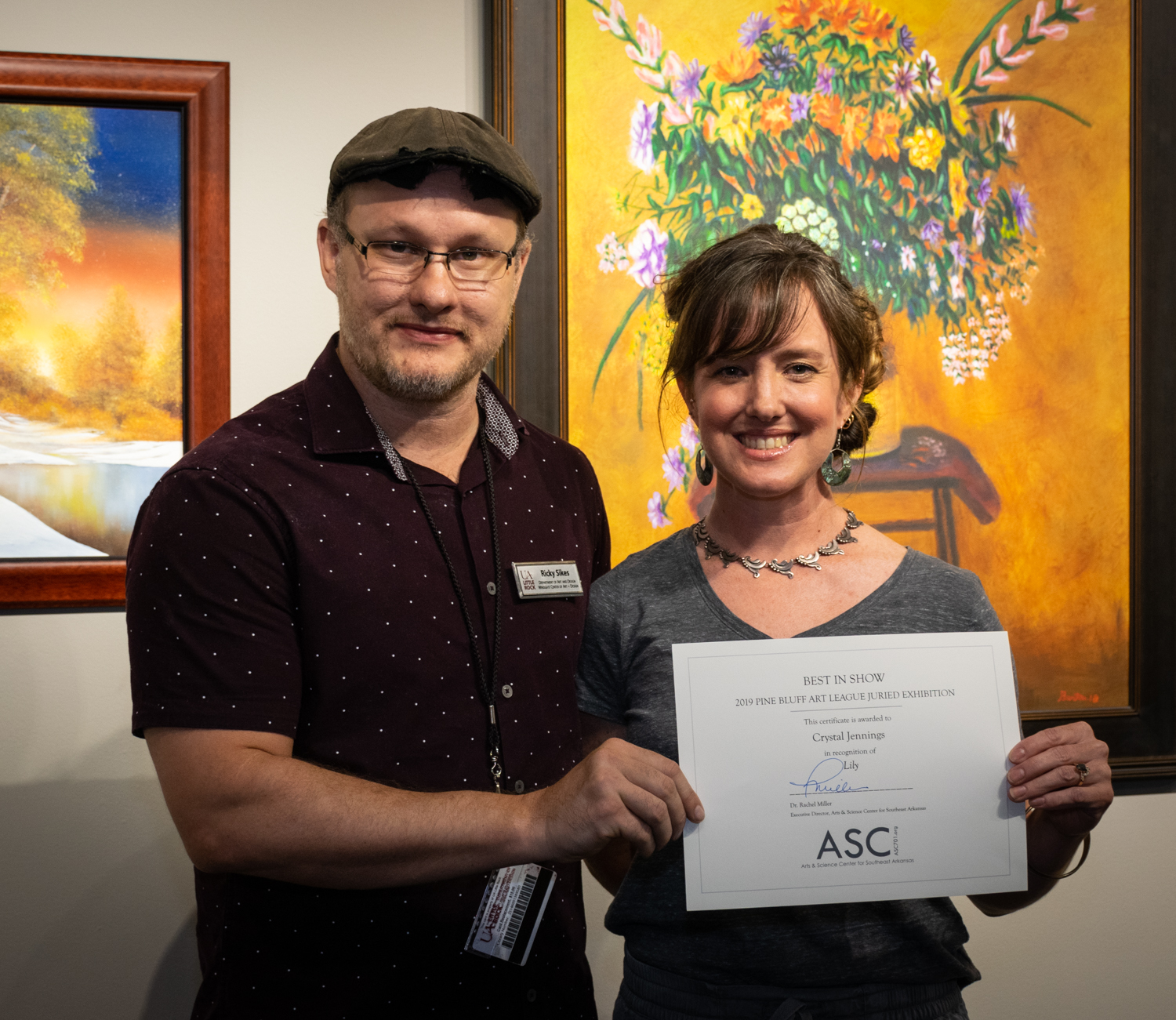  Crystal Jennings (right, with juror Ricky Sikes) won an Honorable Mention for her graphite drawing  Chrysalis . 