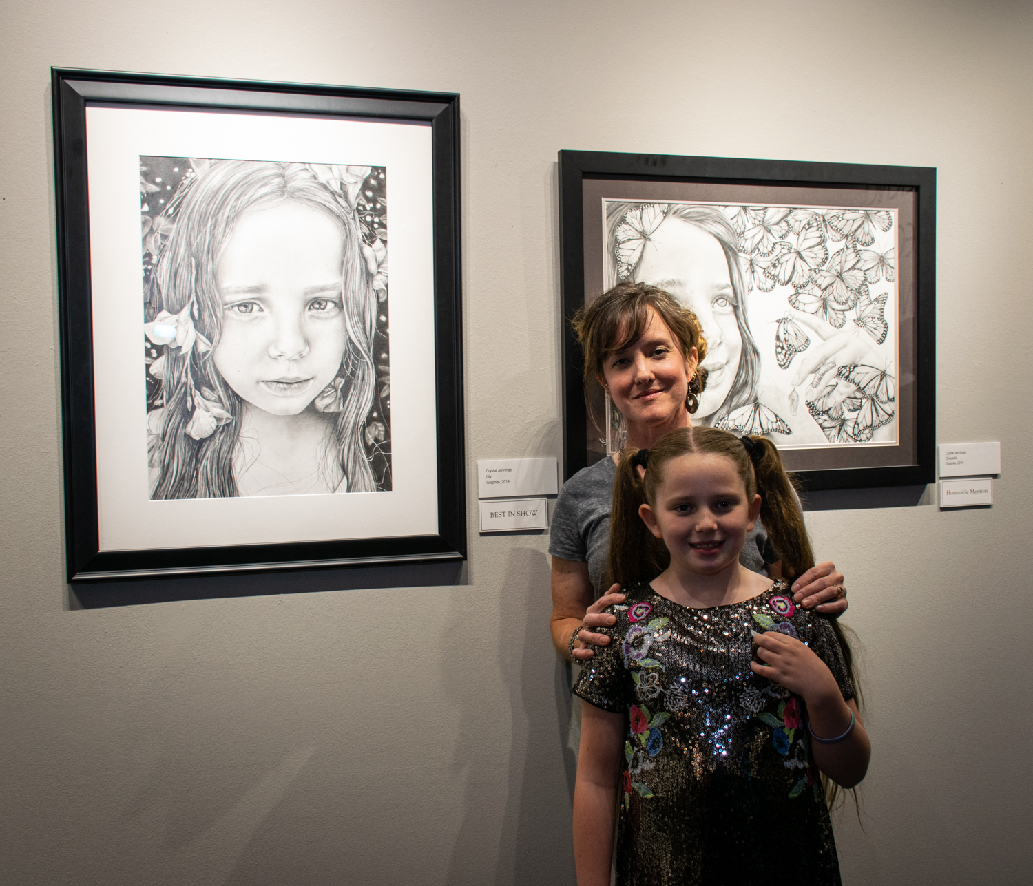  Crystal Jennings with her daughter, Lily, model of her award-winning drawings. 