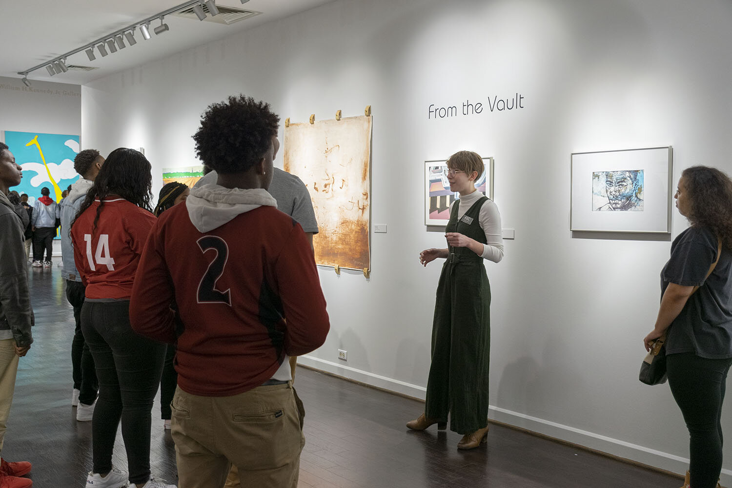  Curator Chaney Jewell leads a Dollarway High School tour group through the exhibition   From the Vault: Works from the Permanent Collection   in the Ben J. Altheimer Gallery, in March 2020. The exhibition was sponsored by the Kline Family Foundation
