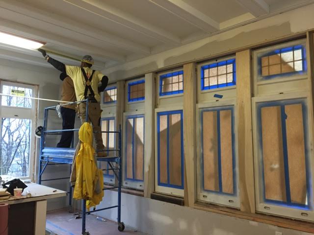 Pictured above: restoring the beamed ceiling. 