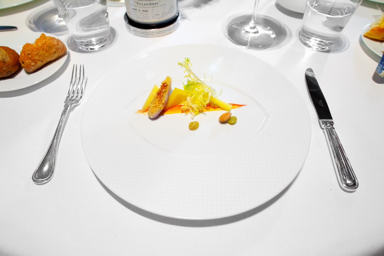 8th Course - "Comté Reserve," Eggplant, Sultana Raisins, Marcona Almonds, Frisée and Red Snapper Essence