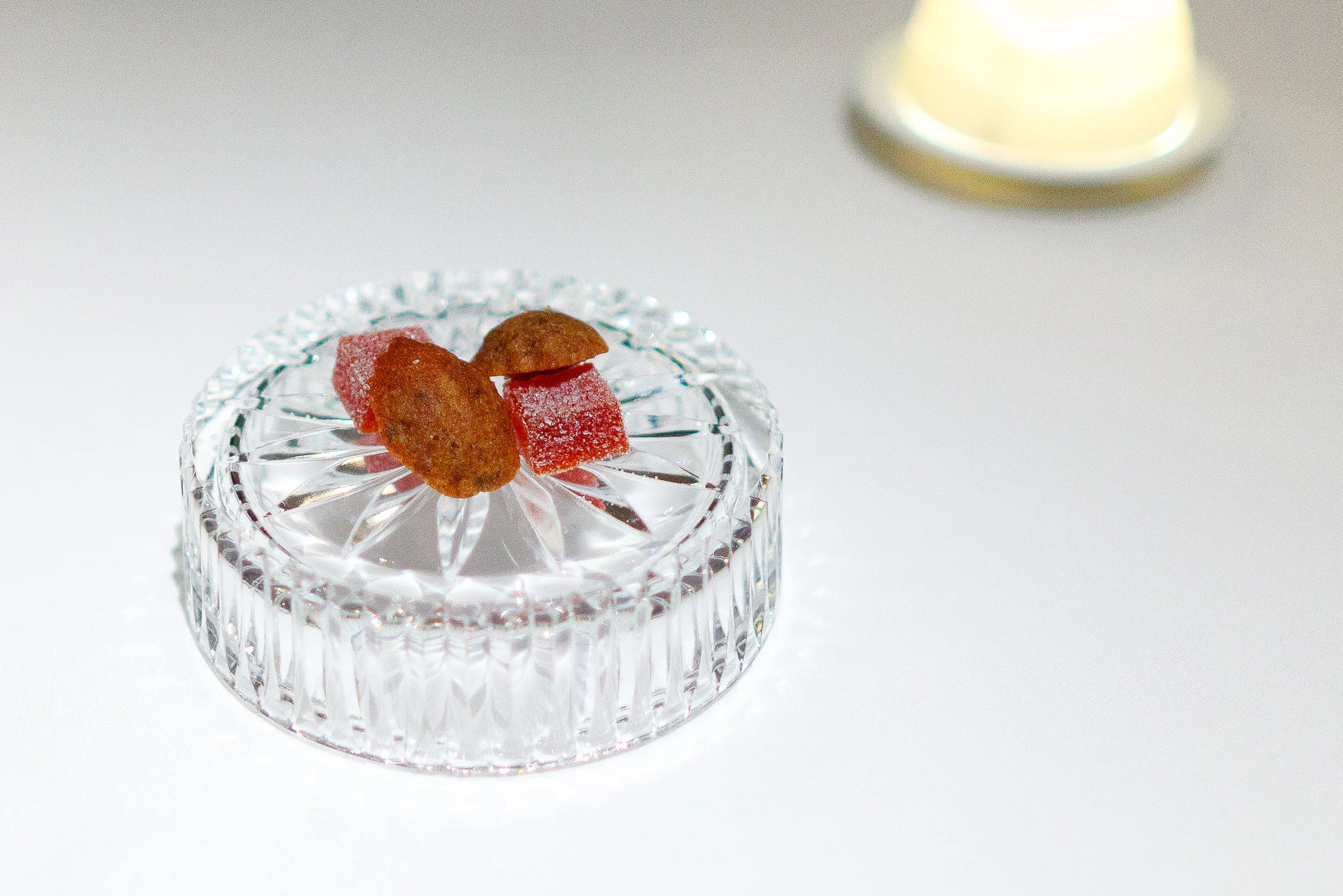 Amuse bouche - Black olive madeleines and roasted bell pepper pâtes de fruits