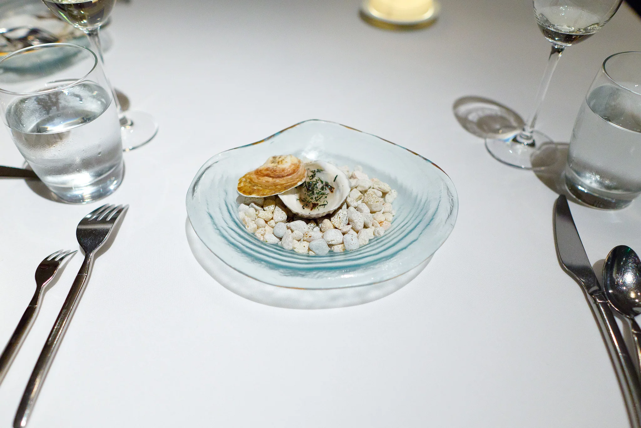 3rd Course - "An elemental oyster" - Lightly poached in its own shell, ocean water gelée, nori flakes