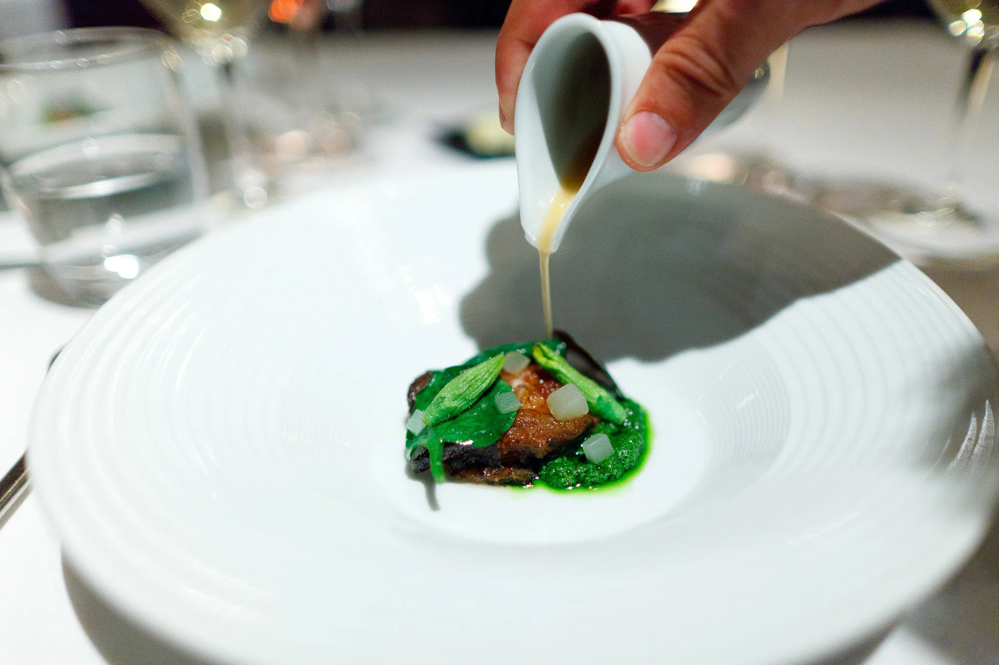 12th Course - Monterey bay abalone cooked in brown butter, pesto of pickled cucumber and walnut, Malabar spinach