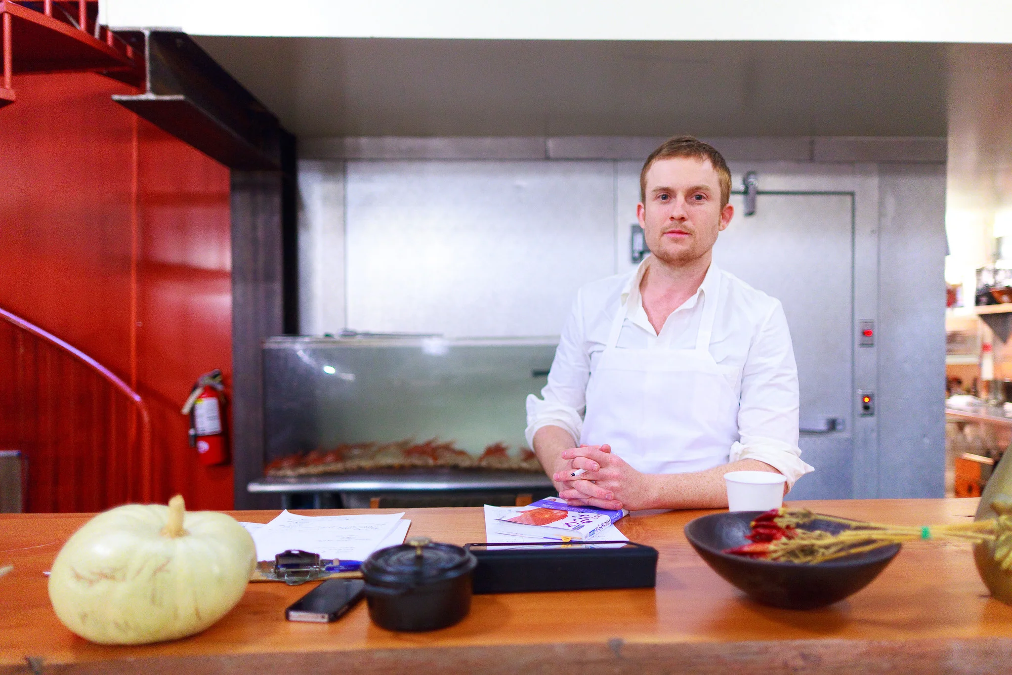 Chef Joshua Skenes with Sakana fish ID book