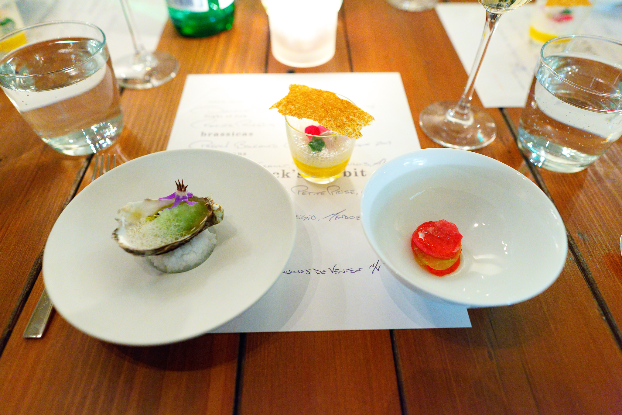 Trio of canapés - marin miyagi oyster, tubers in giant carrot purée, radishes and radish gelée