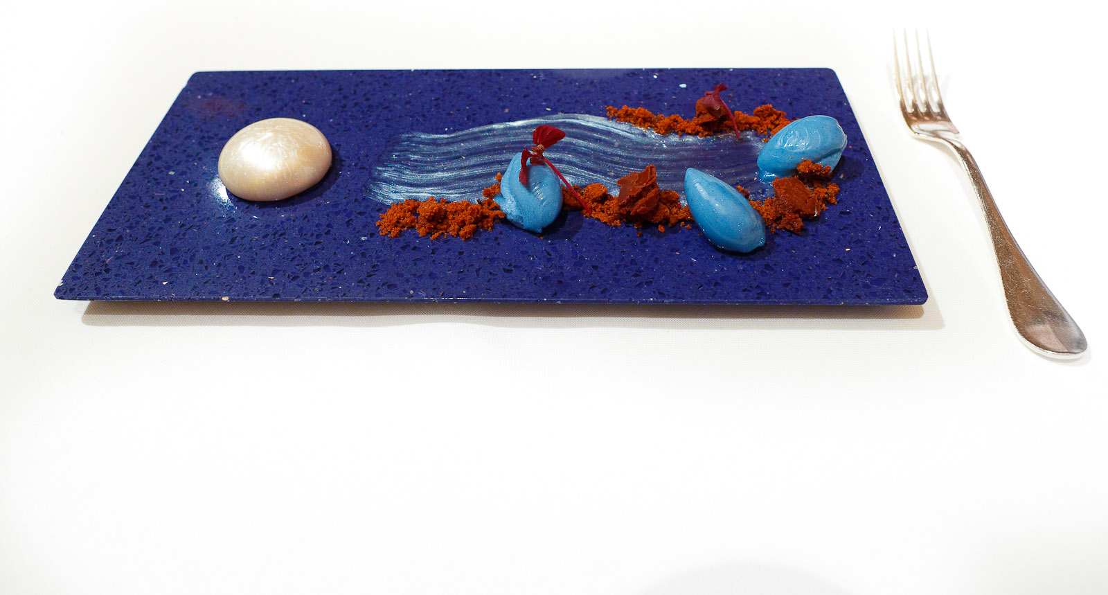 11th Course: Night and Day - Moon, coconut, rum, blue and black ganache