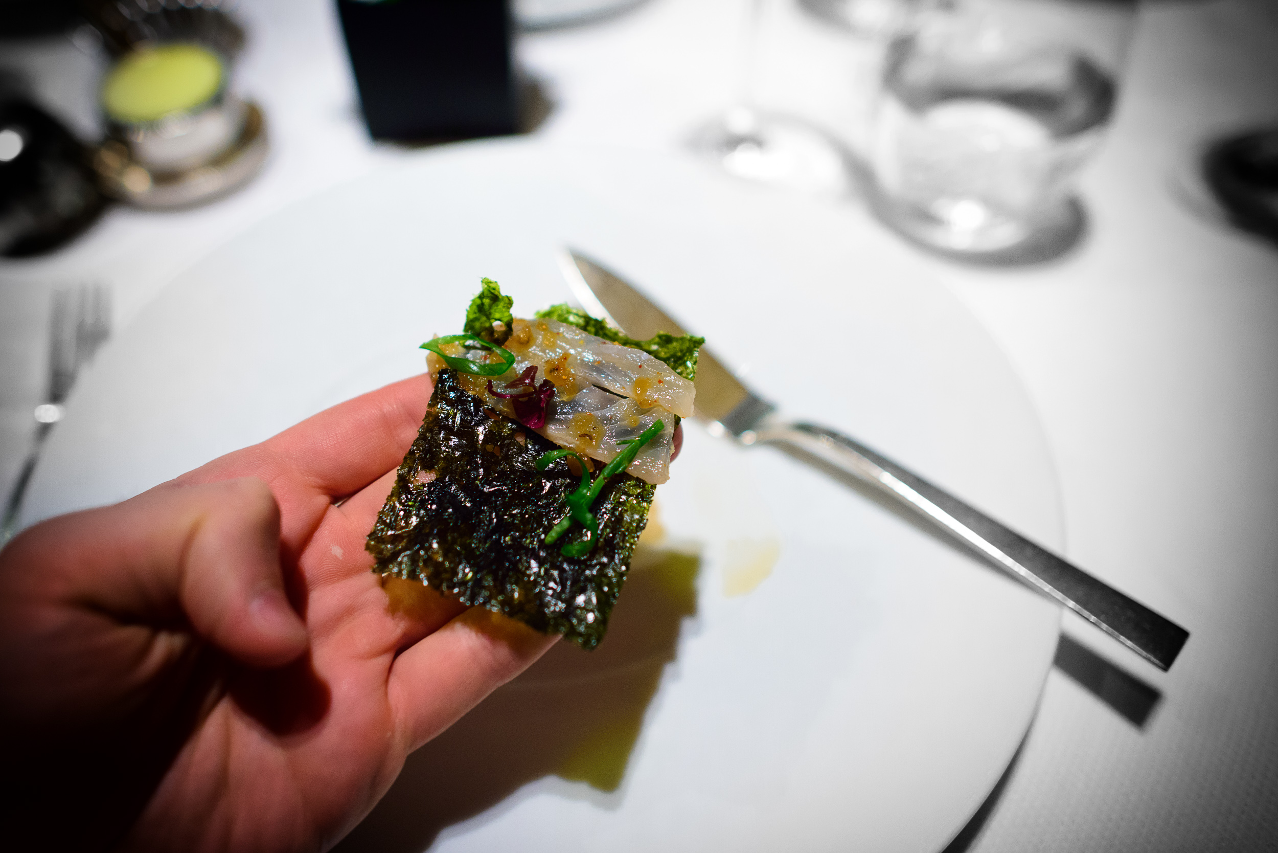 Fluke; slivers of fluke, "wasabi-nori crisp," soy-black pepper v