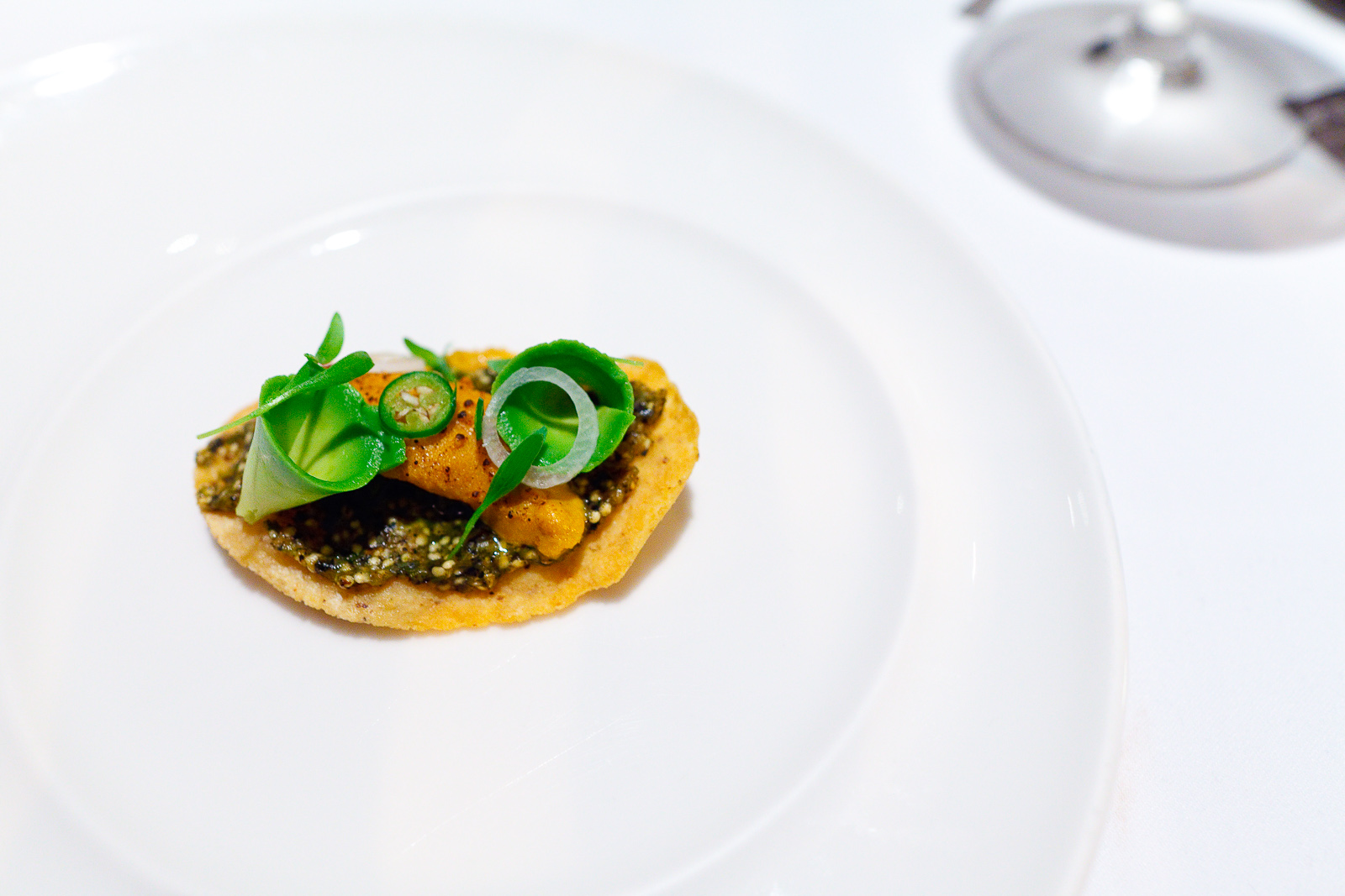 7th Course: Tostada de erizo. Xitomate ahumado. Chile poblano. Aguacate. (Sea urchin tostada, smoked tomatillo, poblano pepper, avocado)