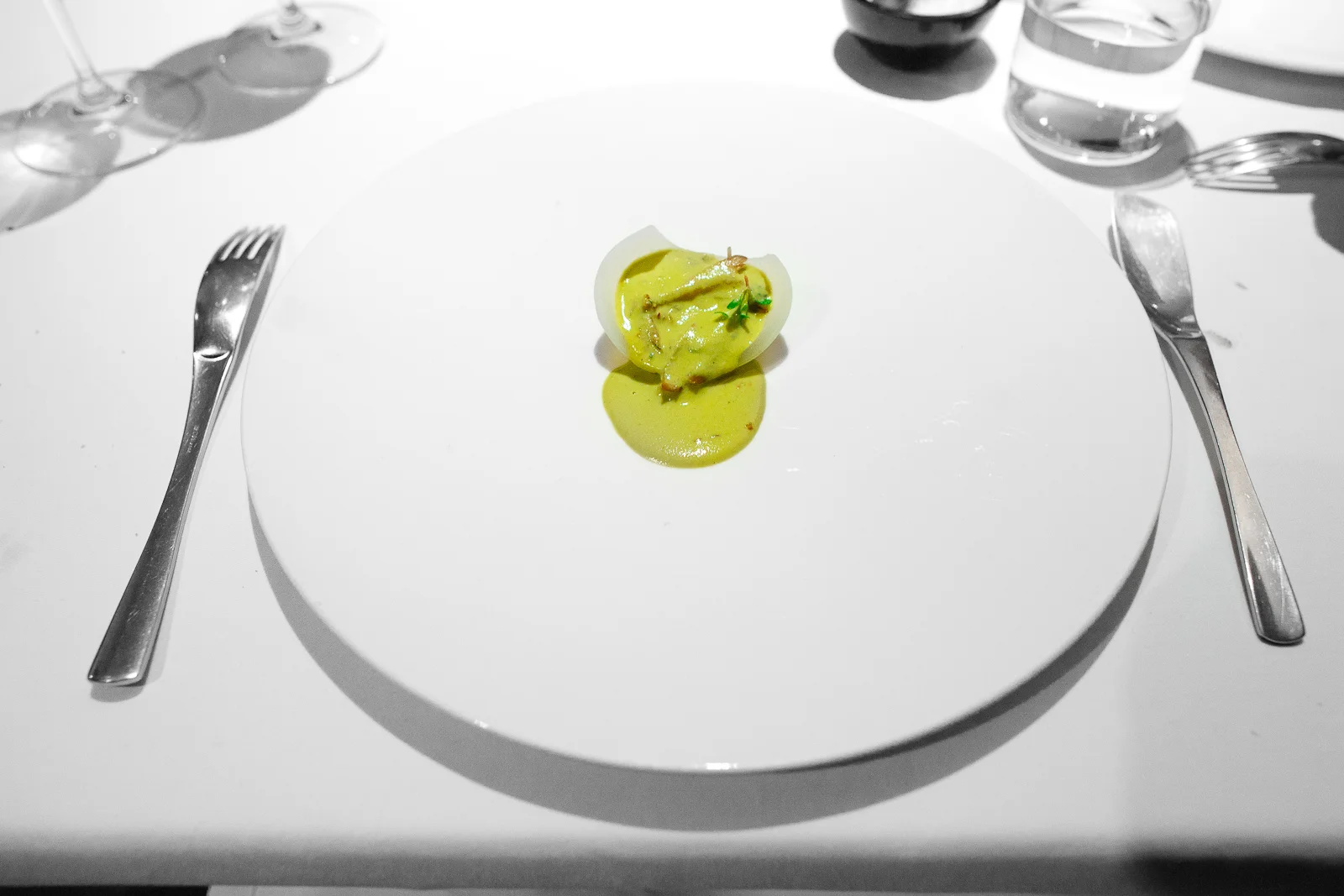 5th Course: Pig ear in mole verde served in an onion tortilla
