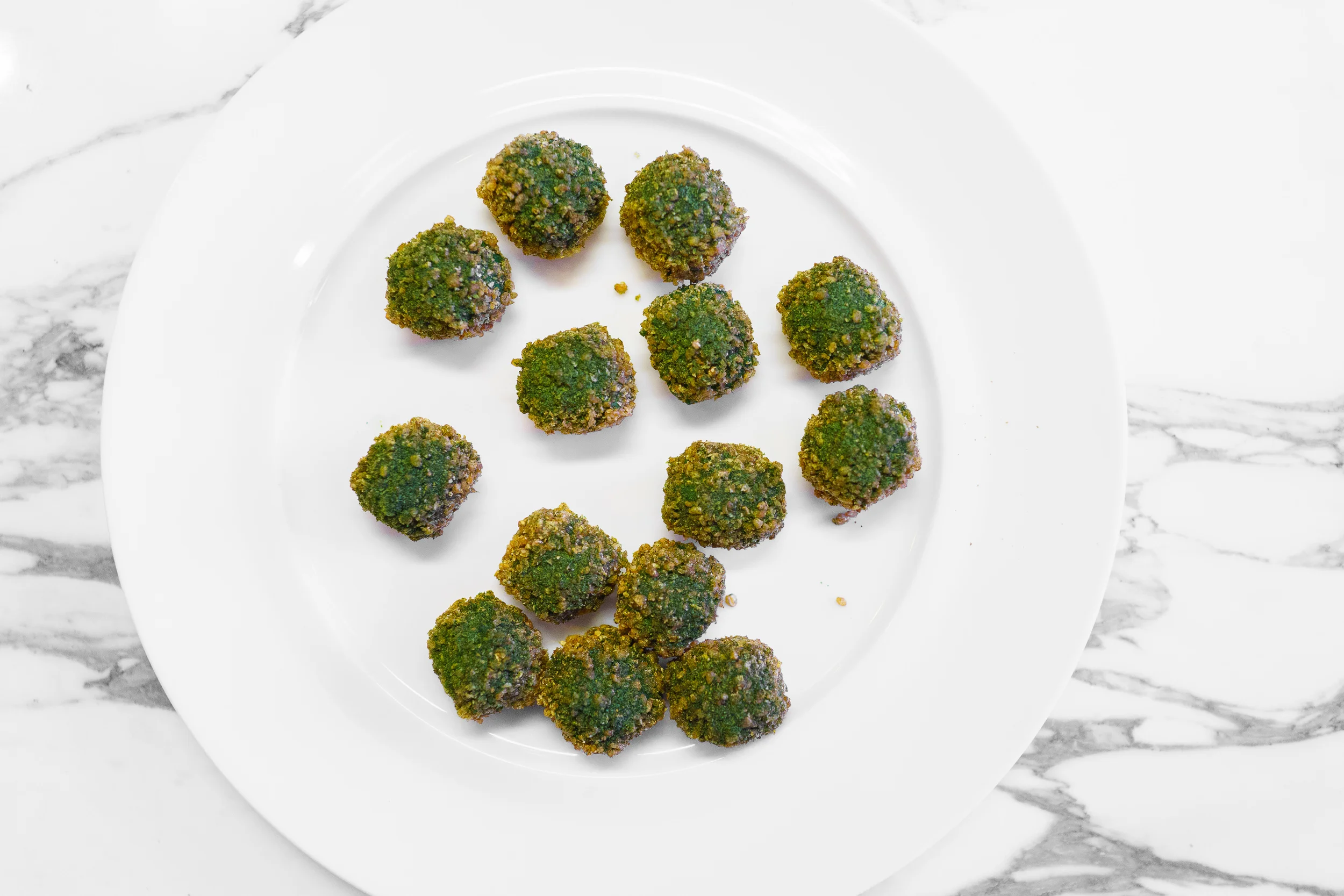 Quail eggs with spring-herbs and roasted seeds