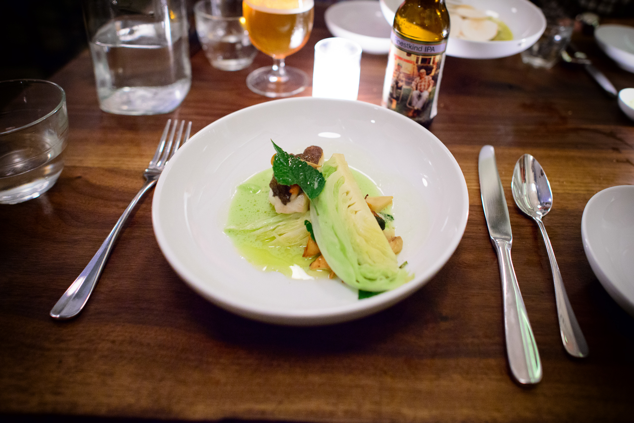 Cod with cabbage, chanterelles, lobster mushrooms, and anise hys