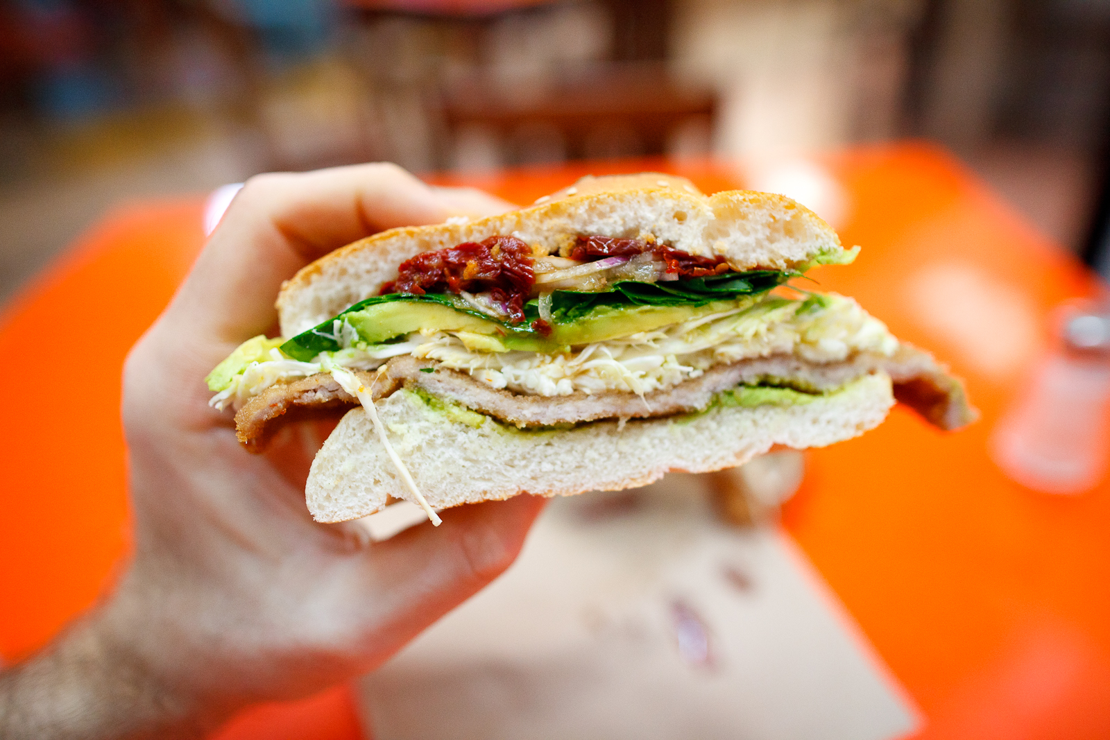 Cemita de milanesa con chipotle (breaded pork sandwich with pápalo, avocado, quesillo, chipotle) (30 MXP)