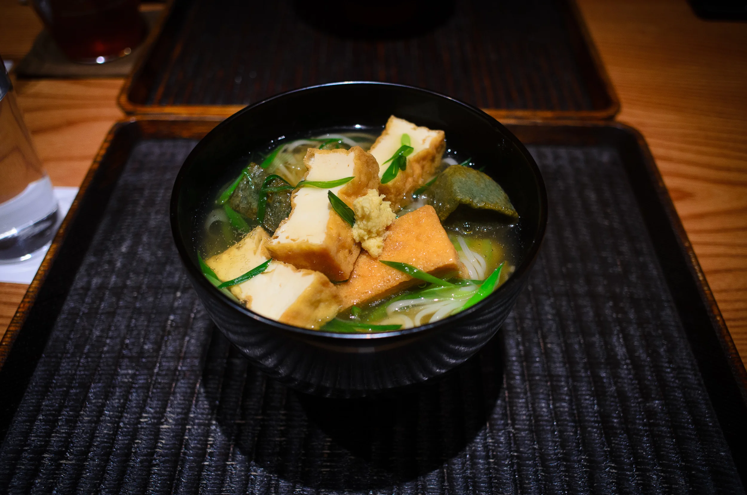 Tanuki udon - deep-fried tofu, yomogi-fu, scallion, ginger