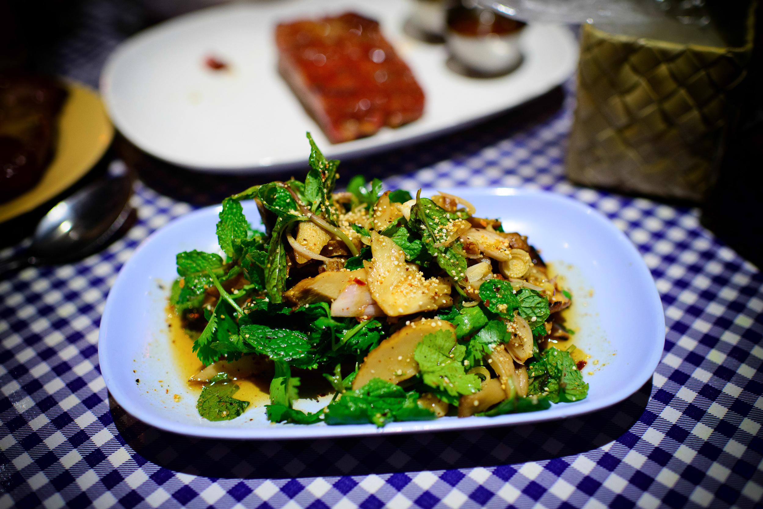 Het Paa Naam Tok - Spicy forest mushroom salad with soy sauce, l