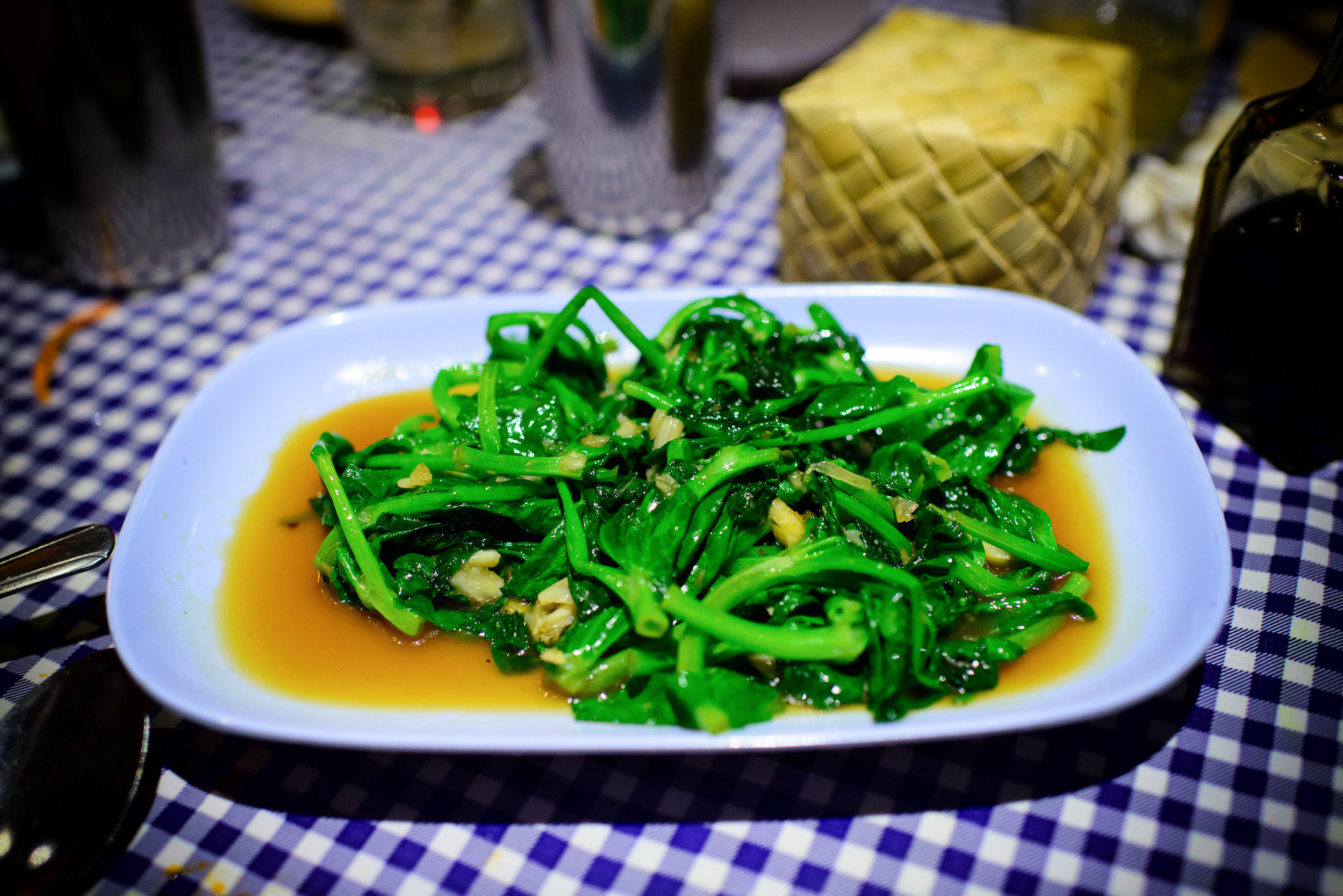 Phat Yawt Thua Lan Tao - Pea greens, stir-fried with garlic, fis