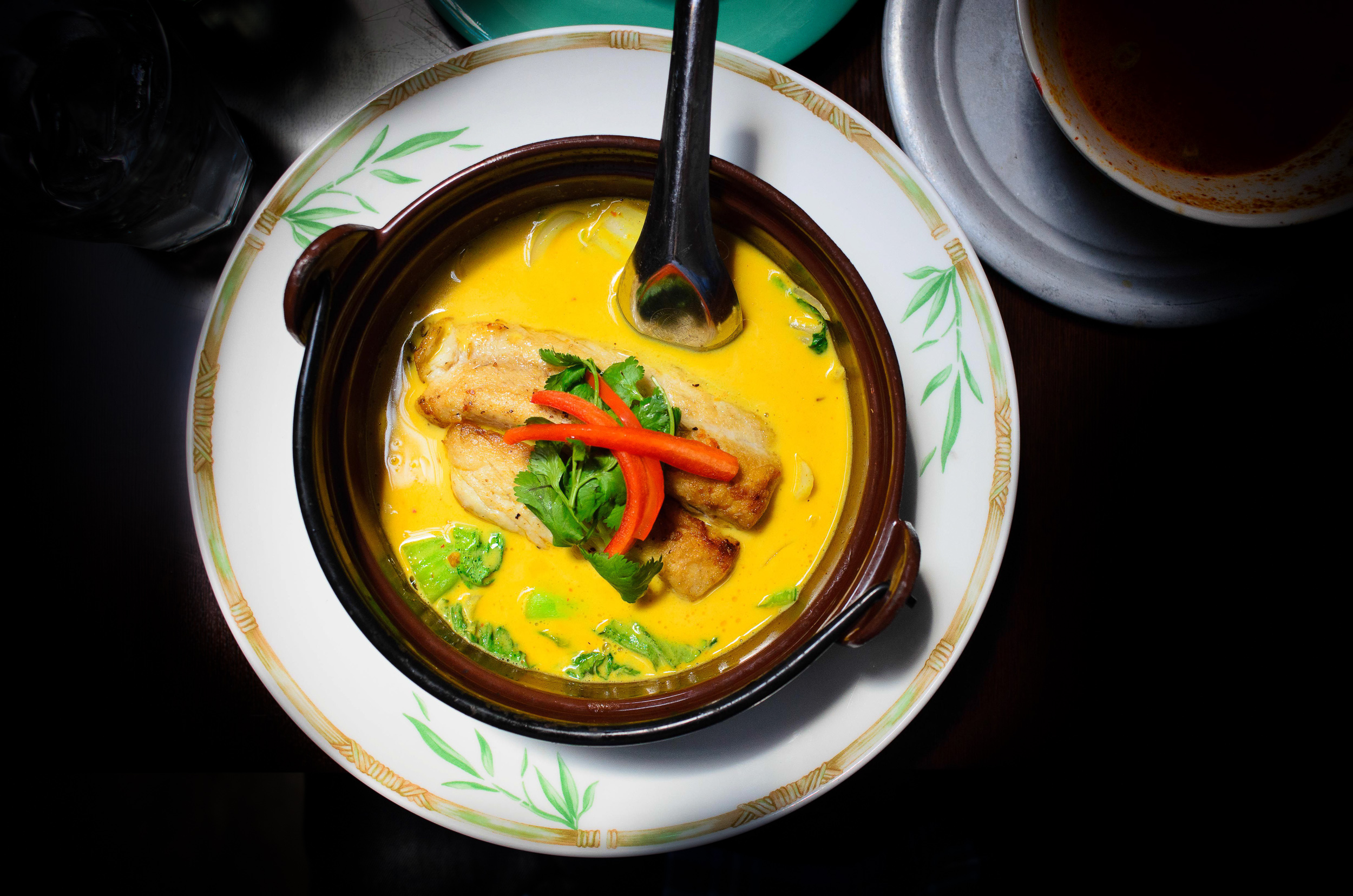 Kingfish "teh-pho" curry in clay pot: bok coy, onions, napa cabb