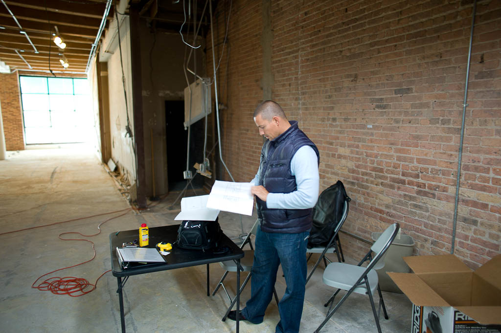 Chef Curtis Duffy looking through floorplans