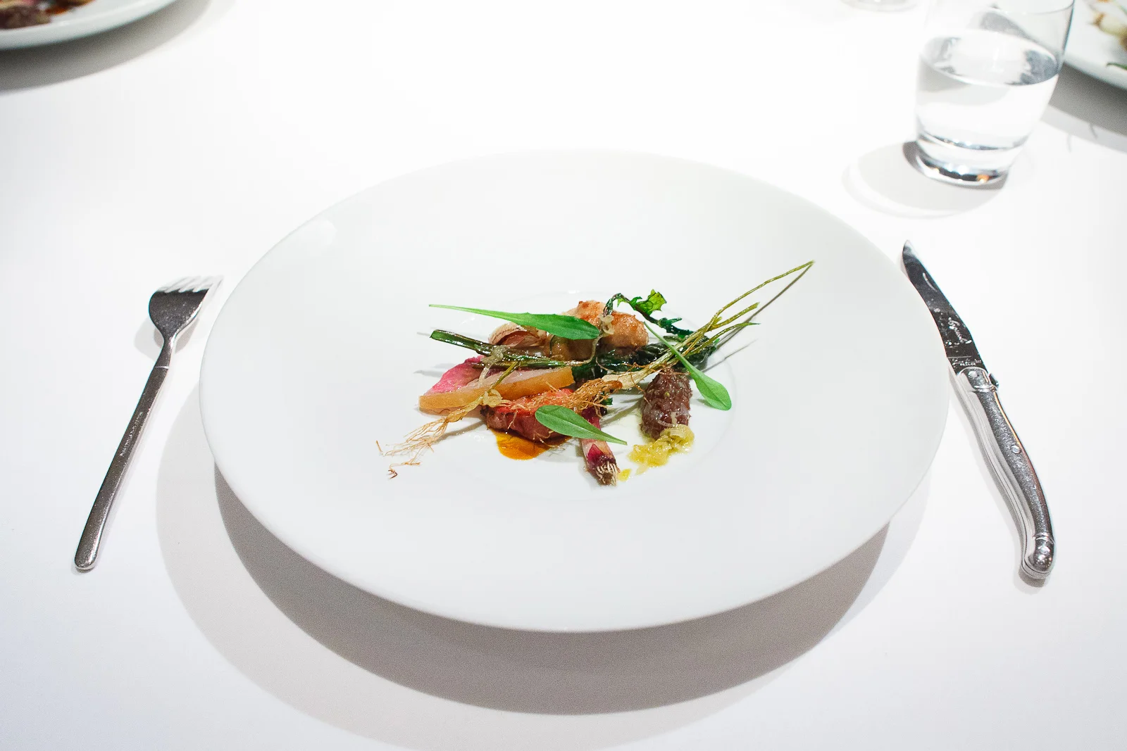 16th Course: Spring lamb roasted in dandelion butter, alliums, o
