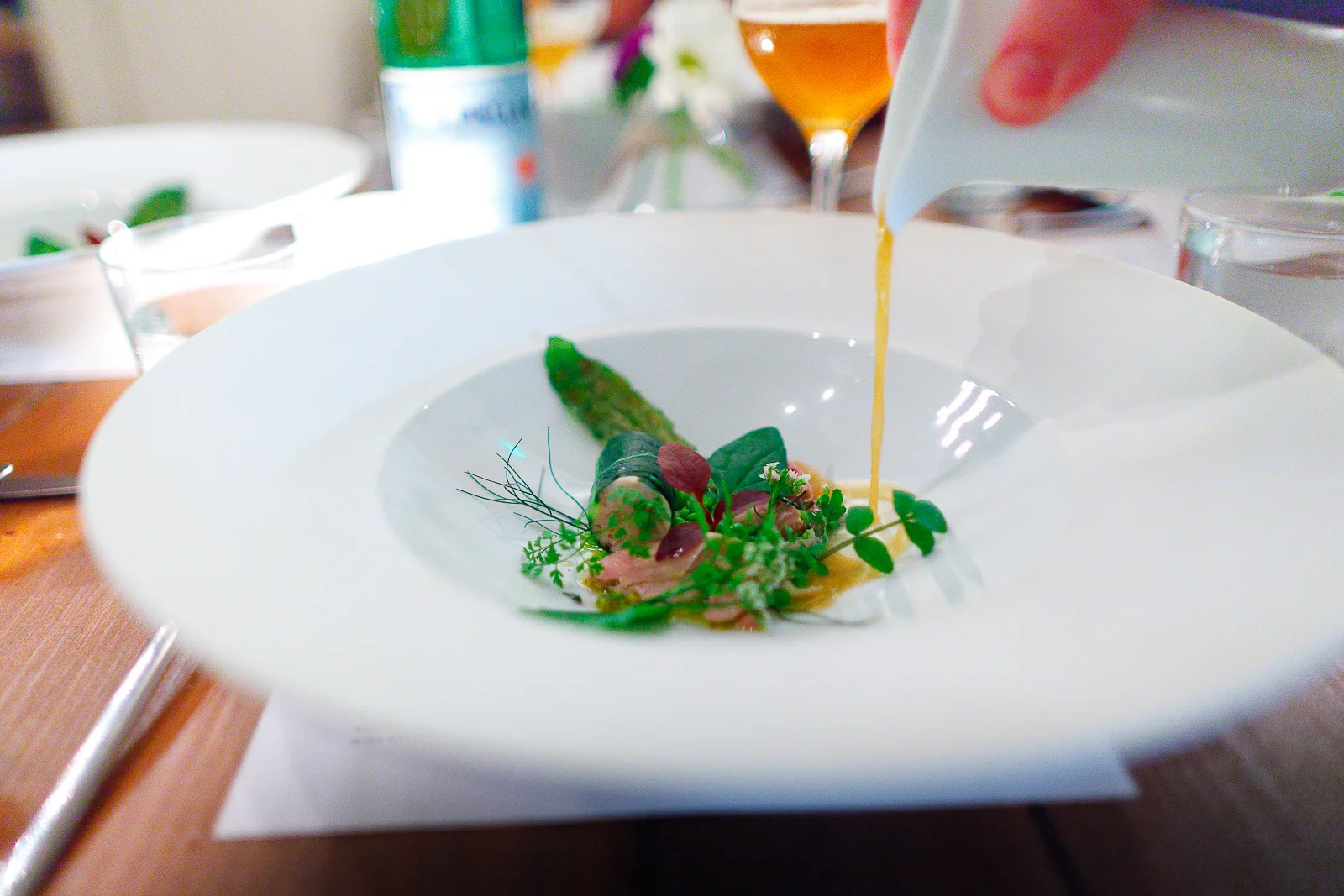 5th Course: Pasternack's rabbit - Hind leg meat, loin, and foie gras combined into a farce wrapped in cabbage. Served with English peas, confit mea
