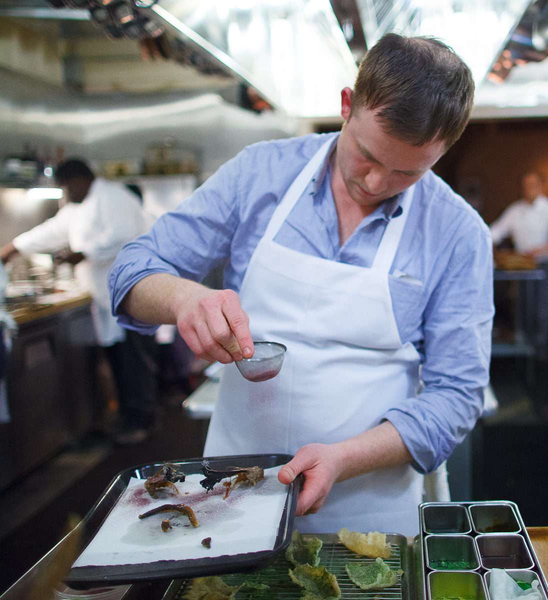 Chef Joshua Skenes preparing the tails from bluefin robin fish