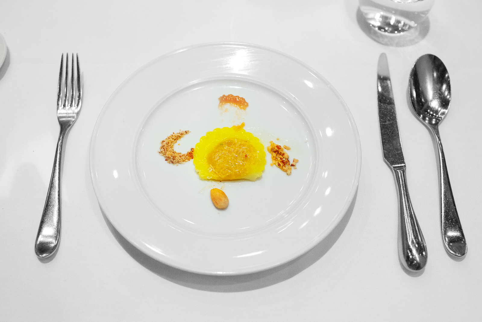 5th Course: Ravioli - kabocha squash, quince mostarda, and almond