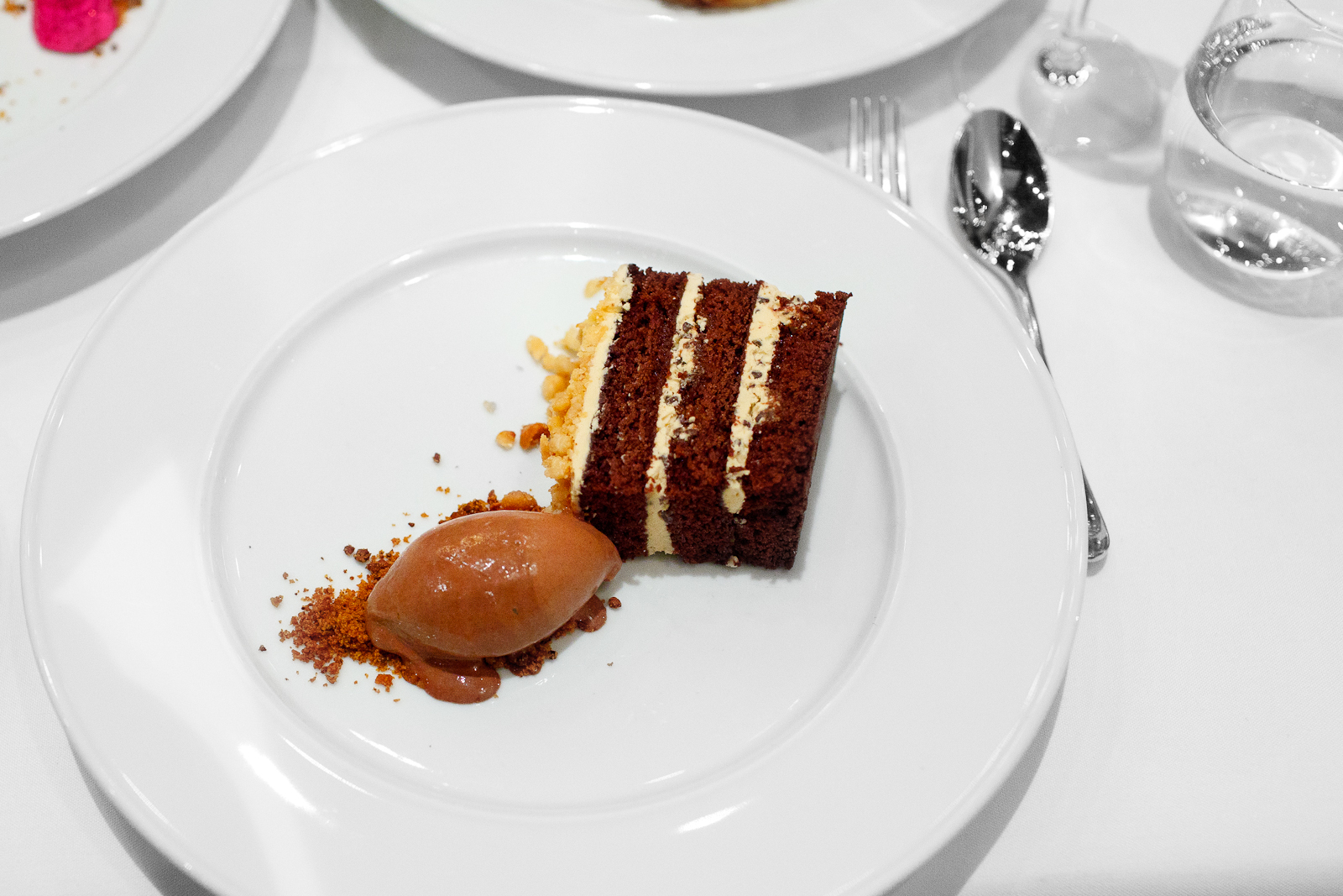 8th Course: Torta de cioccolato - chocolate cake, passionfruit caramel buttercream, macadamia, dark chocolate gelato