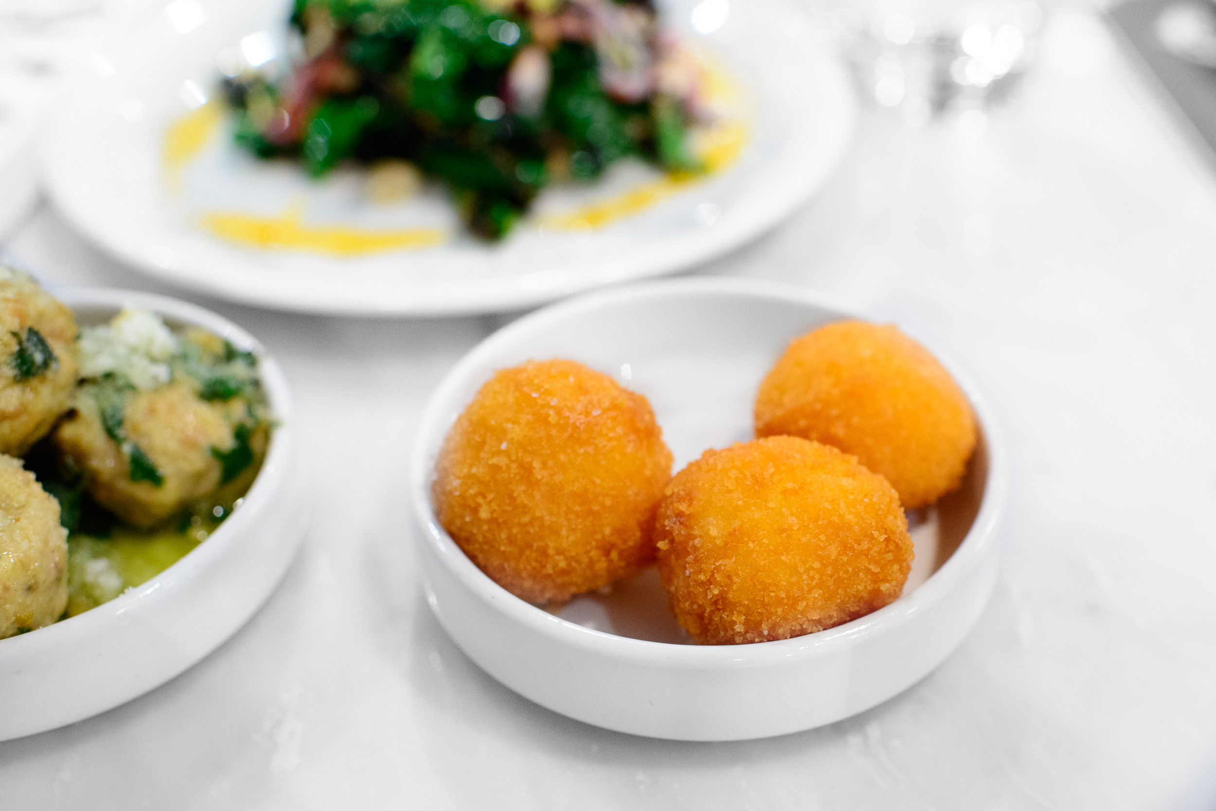 Arancini - risotto, saffron, mozzarella di bufala ($1.5 each)