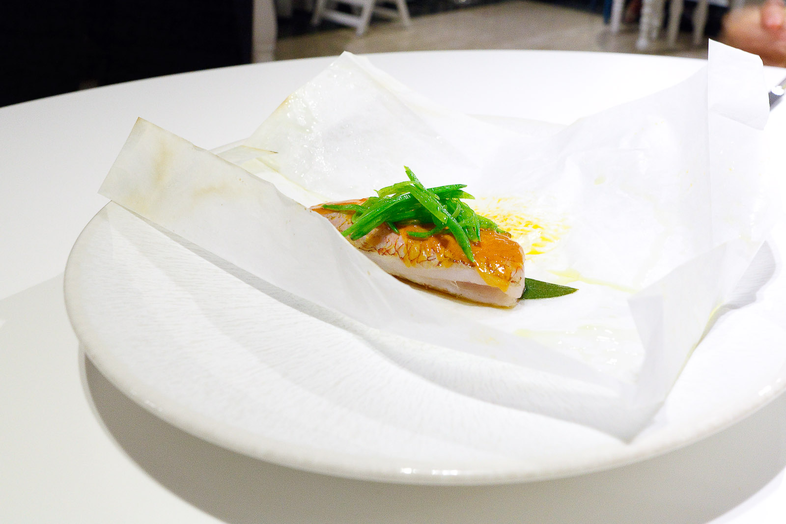 9th Course_ Red snapper en papillote painted with sea urchin sauce.jpg